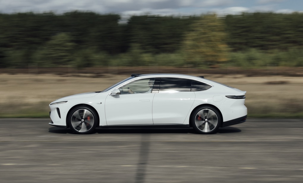 Nio ET7, side on action shot, white car on airfield
